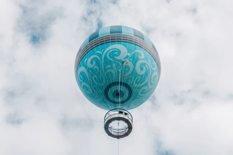 the bottom of a very large blue balloon