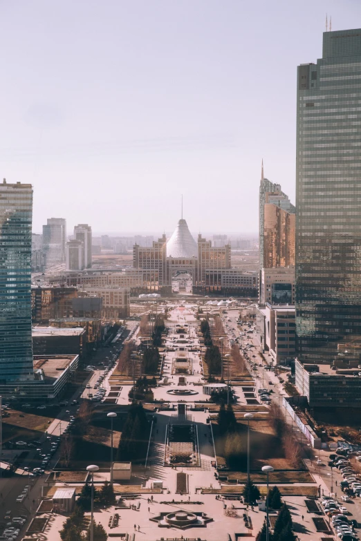 an aerial view of downtown looking across a large parking lot in a city