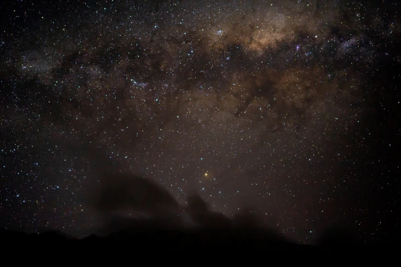 the sky with stars and clouds all over