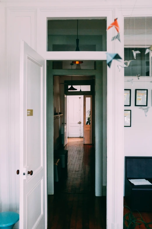 a hallway between rooms of the same size and color