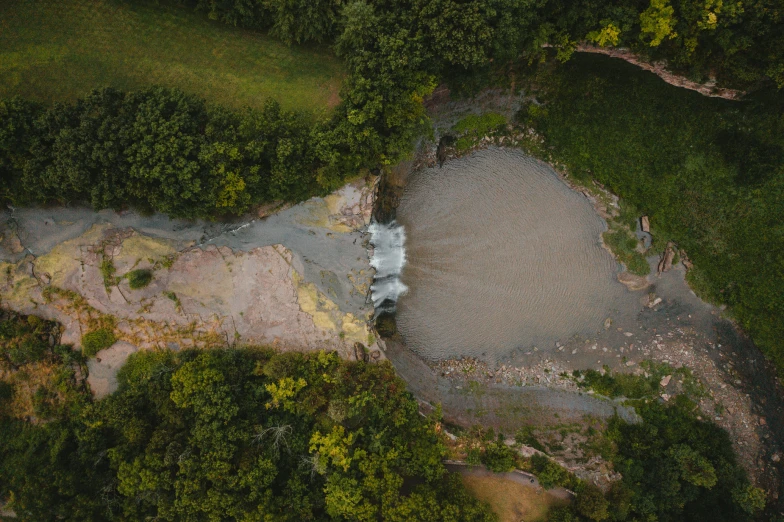 an aerial s of an area with rocks, trees and grass