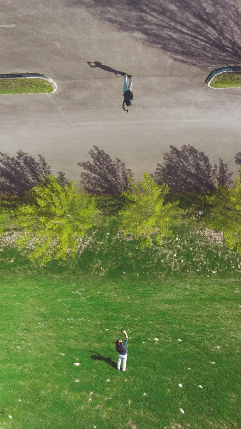 an aerial view of people playing on a field