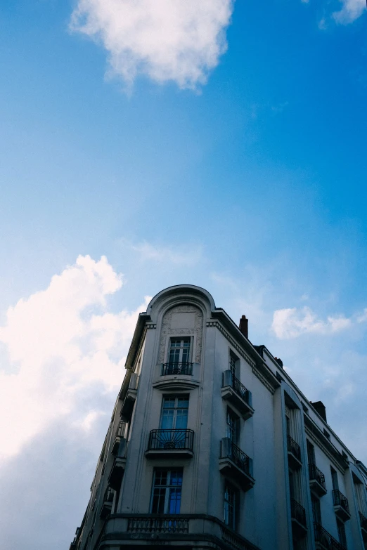 the back side of an old building with an open balcony