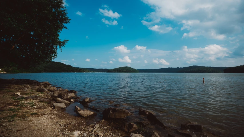 a body of water next to some rocks