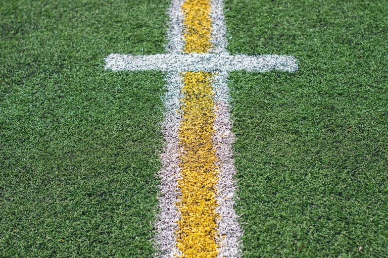 a white line on a green soccer field