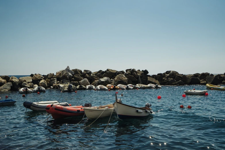 small boats floating on the blue water