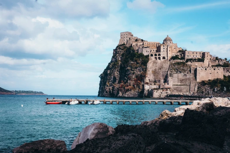 there is an island with a bridge that crosses over the ocean