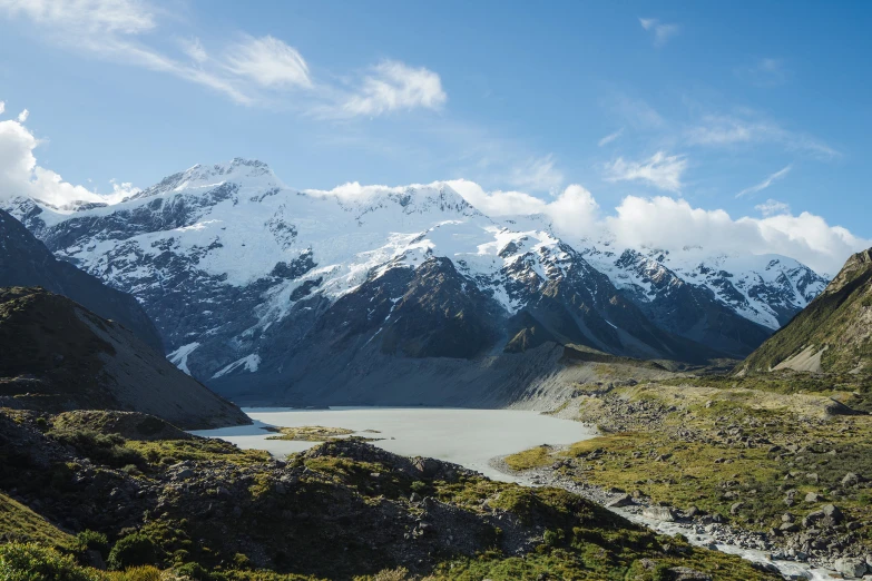 the mountain is surrounded by a green patch