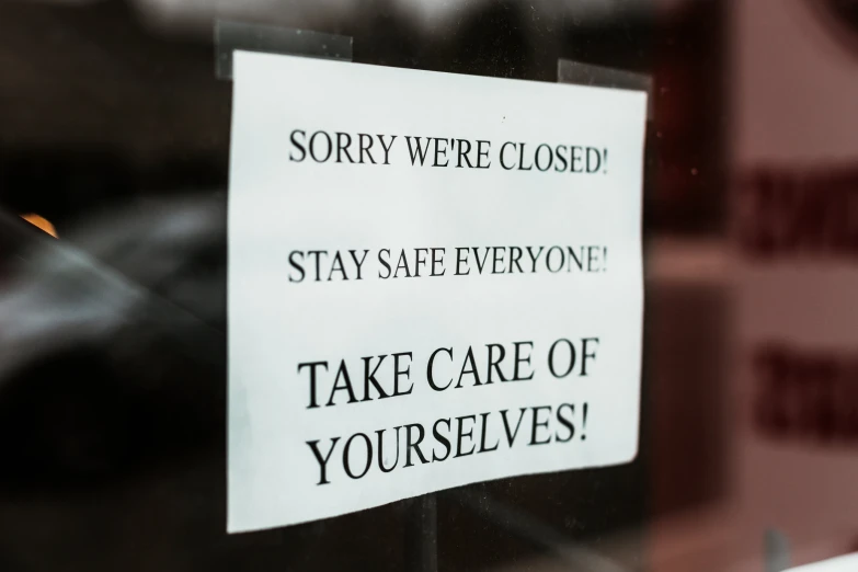 a sign posted on the door of a building