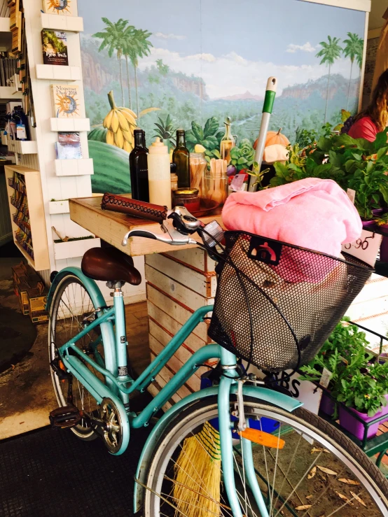 an old bicycle with a basket filled with stuff