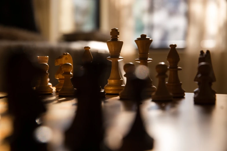 a black and white chess set on a table