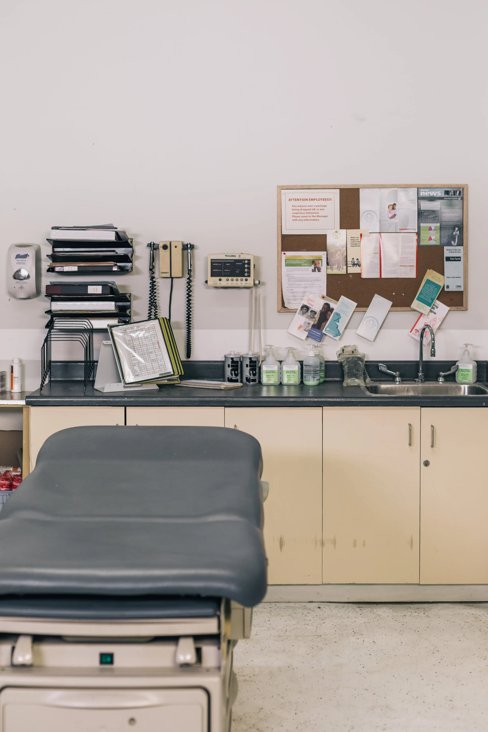 a doctors office with a table and chairs