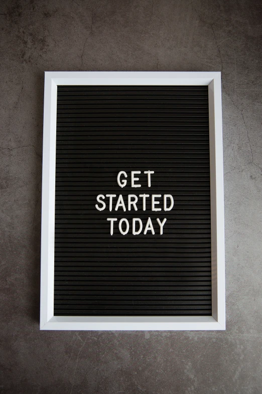 a sign reads, get started today