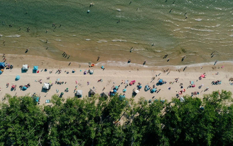 the beach has many people on it