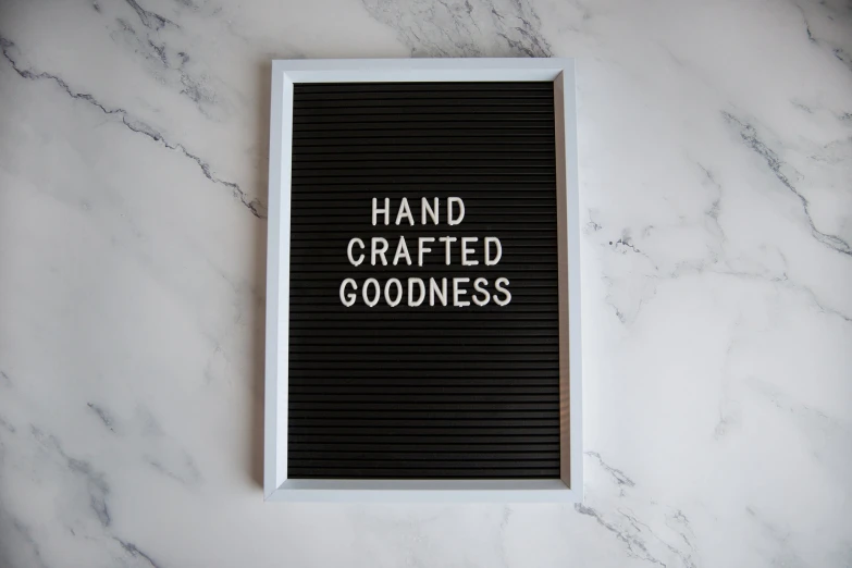 the hand crafted goodness book on a marble counter