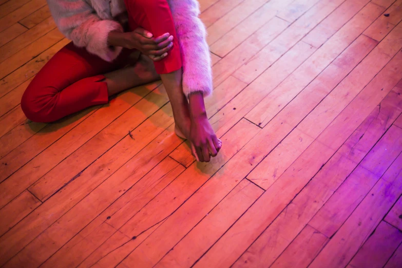 a woman on her cell phone on the floor