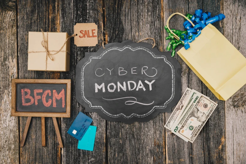 the message cyber monday and gifts are on a table