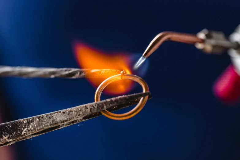 two pairs of metal rings with a wire being connected to it