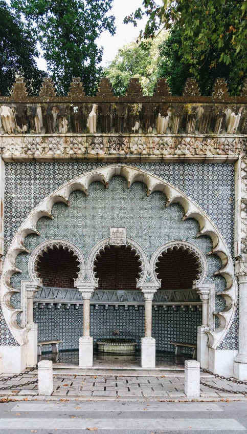 a stone and tile archway between two rows of windows