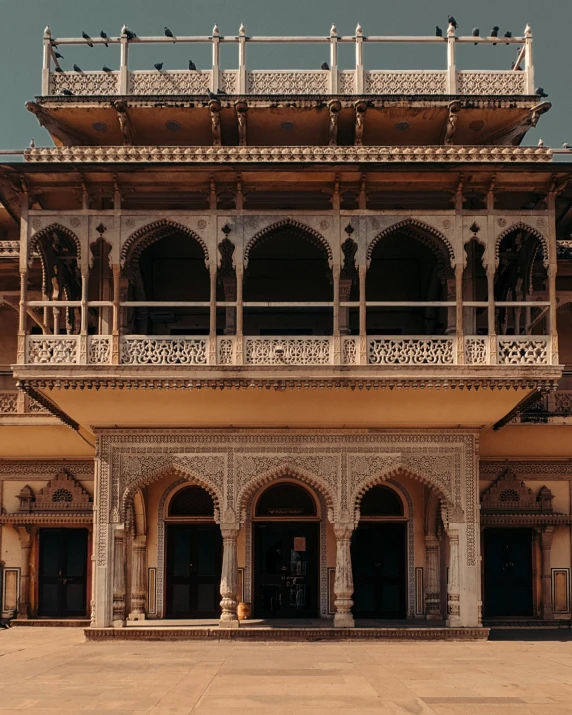 an ornate building with balconies and pillars