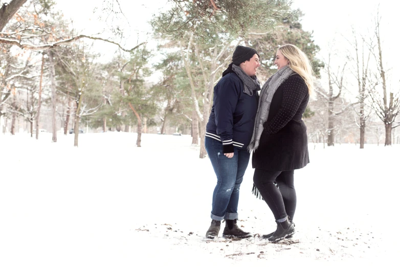 two people are outside in the snow