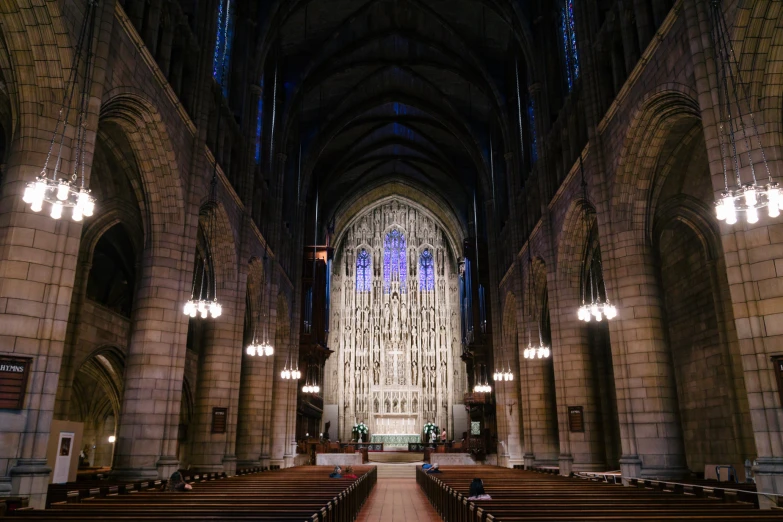 the empty pews at the end of an empty cathedral