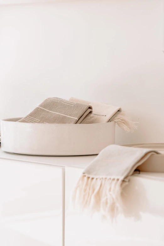 a bathroom with a white counter top with a white bath tub