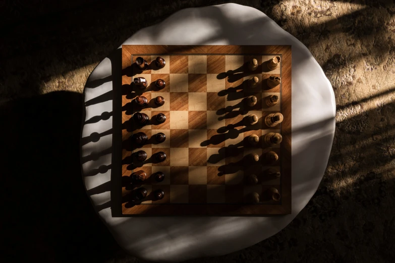 a chess board with two squares and a piece of wood