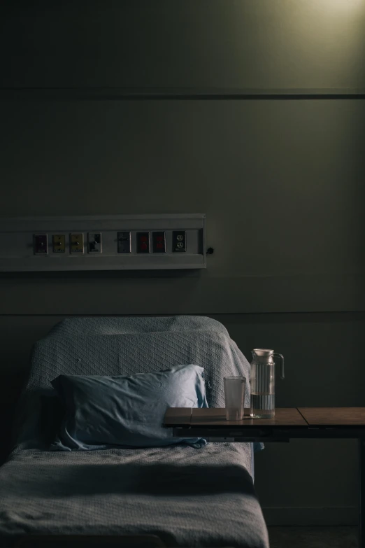 a lit up table and two cups on a bed