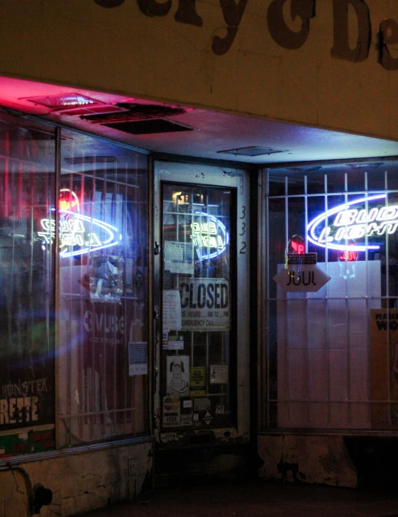 a store front with signs and lights on it