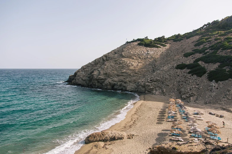 a rocky beach with a view of the ocean