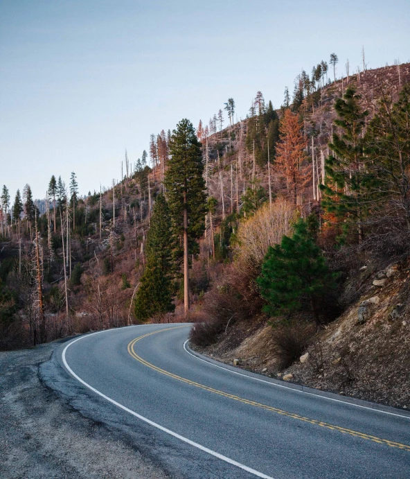 a winding road in the mountains in winter