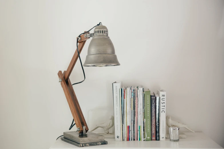 a metal lamp and some books in a room