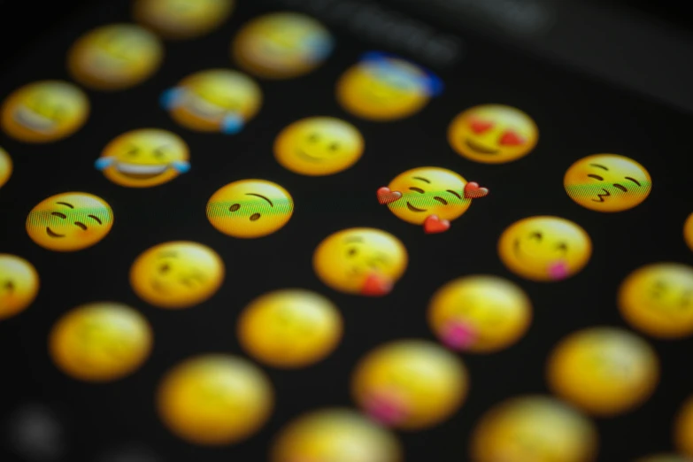 close up s of various emojts made to look like different people