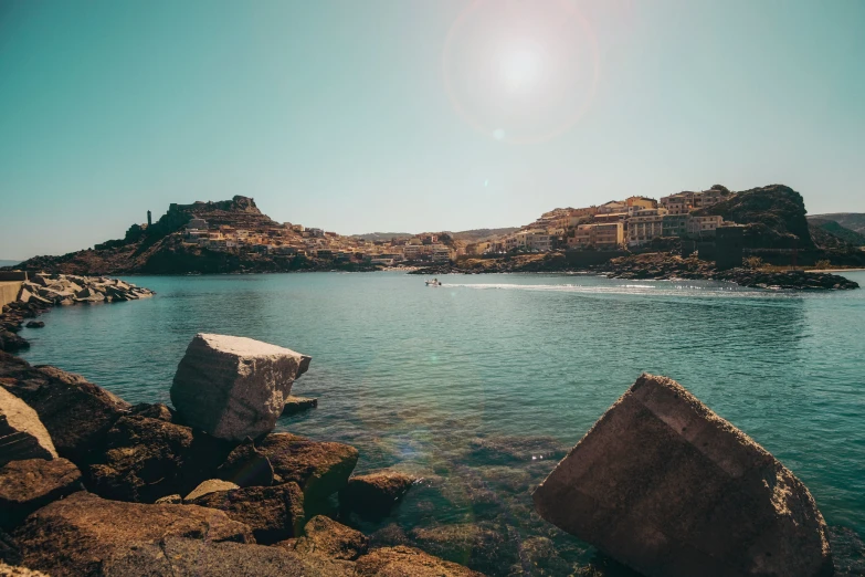 an ocean with a rocky shoreline and some small rocks