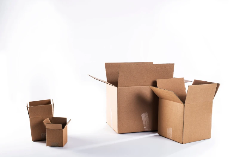 two boxes and some empty boxes on a white background