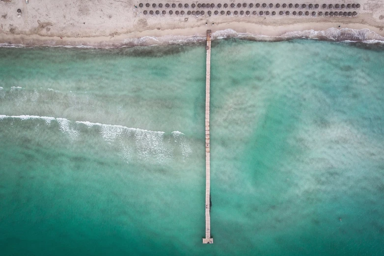 an overhead view of a pier in the water