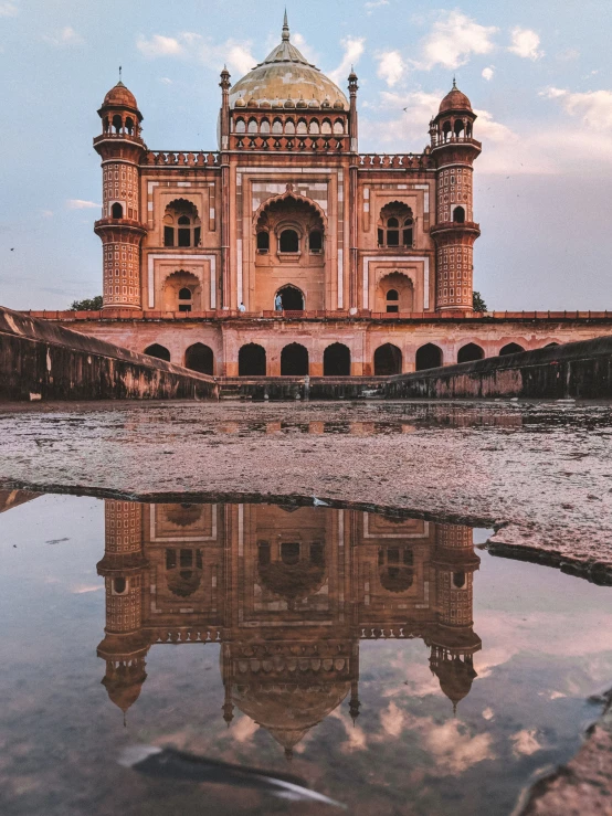 a large building with a dome sitting above water