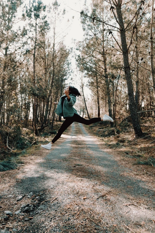 an image of a woman that is jumping for joy