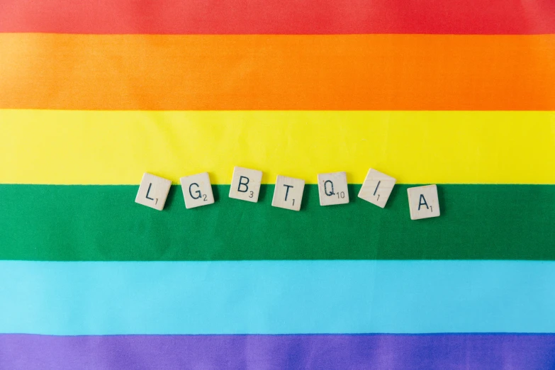 a rainbow colored background with some letters that spell out ligtigia