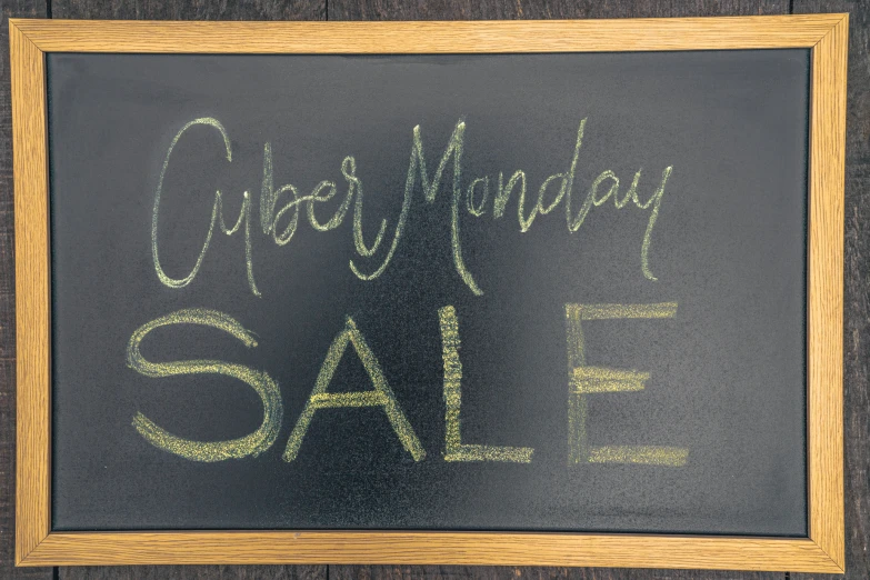 a black sign that says cyber monday sale