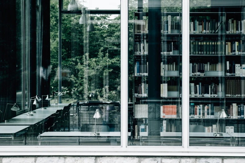 an image of a room filled with books and sitting area