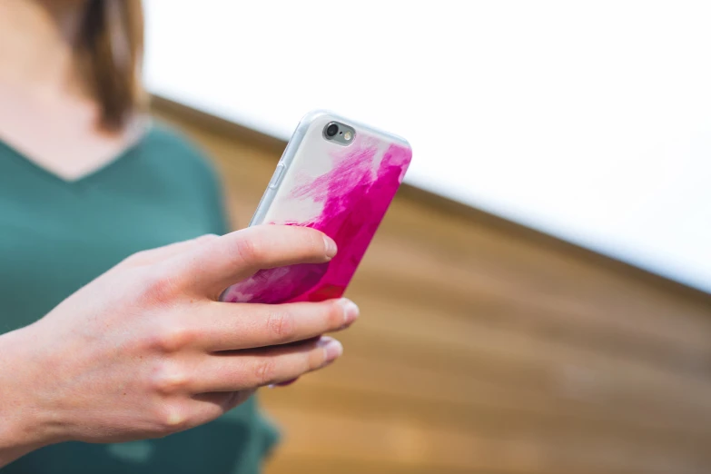 a woman uses her cell phone in the room