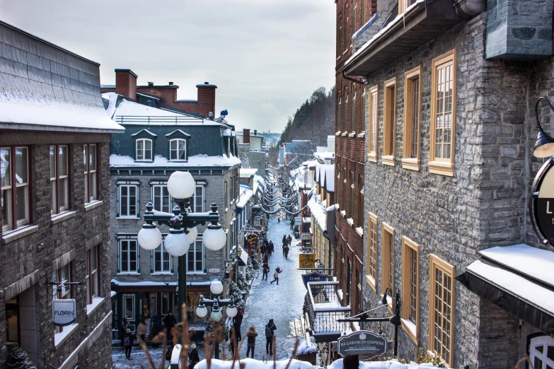 a view down a narrow street in the snow