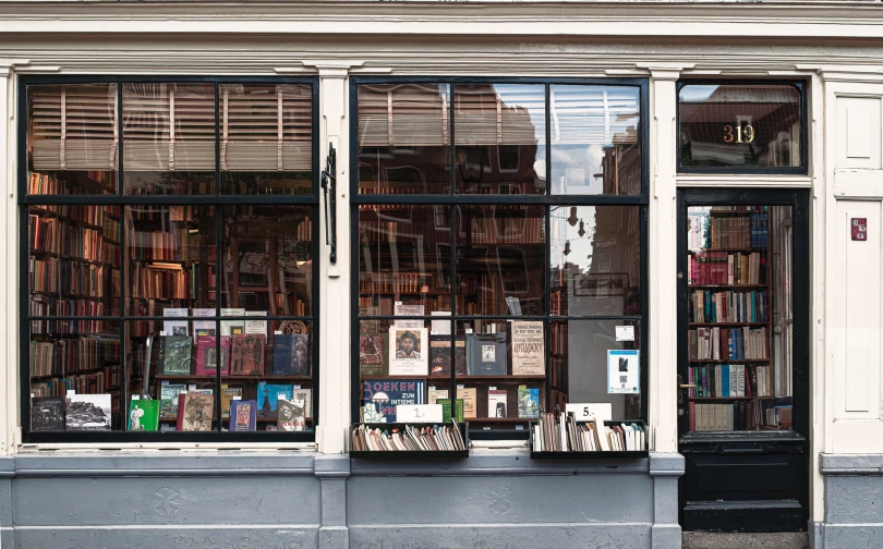 two large windows with open books sit on either side