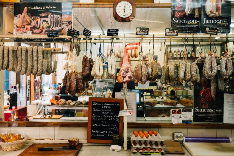 a butcher shop with meat hanging from the ceiling