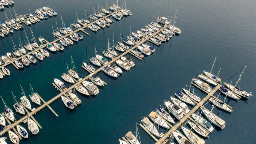 an aerial view of a large body of water filled with boats