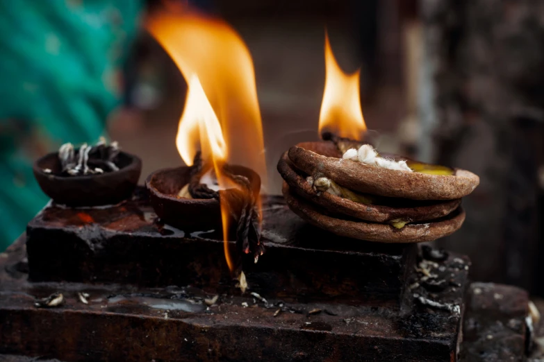 the flames are burning next to small round cookies