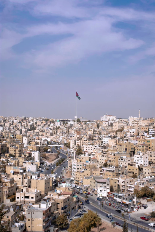 an aerial view of a city with a flag on it