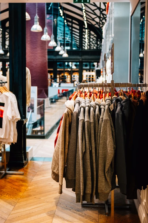 several clothing hang in an open air market